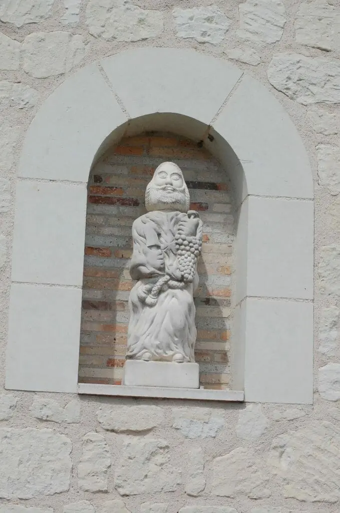 A statue of Saint Vincent holding grapes